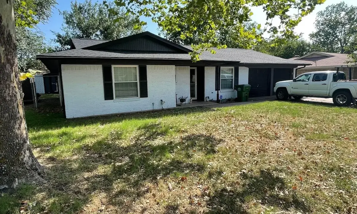 Professional roofing crew working on a residential roof in Rockwood